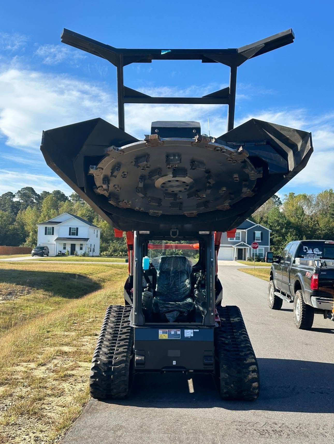 Knock'Em Down Solutions tracked mulcher on trailer ready for land clearing